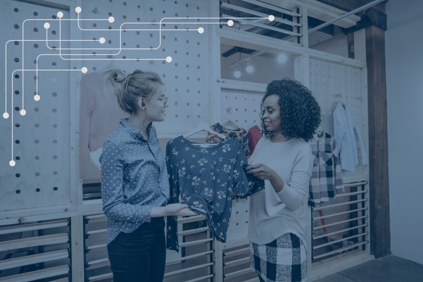 a store associate helping a customer pick out a shirt