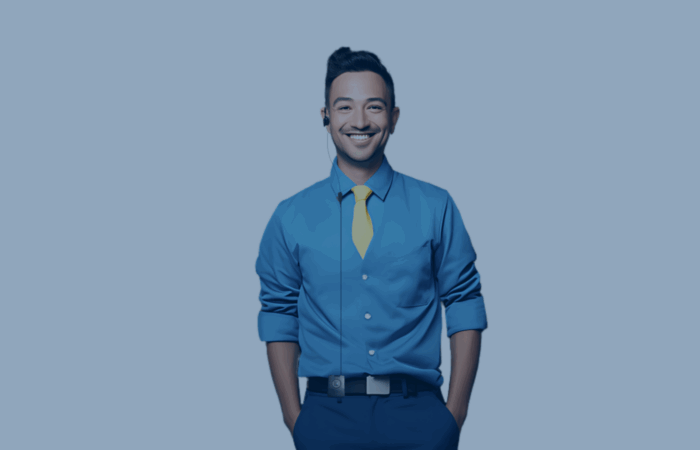 a retail employee wearing shirt and tie, smiling as he has theatro headset and communicator
