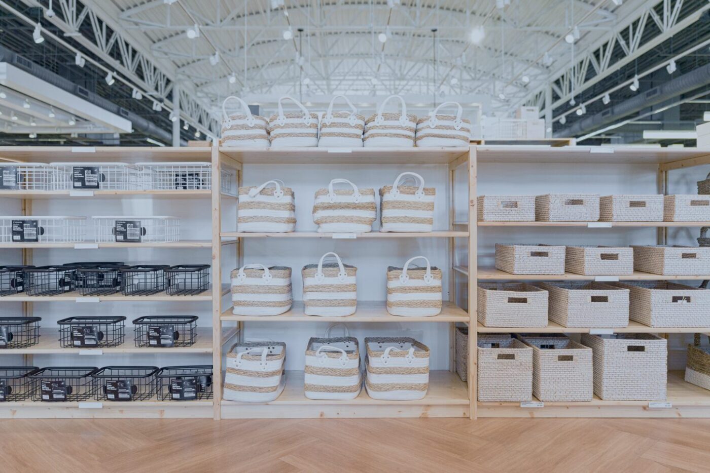 a photo of a row of shelves in a big box store showing storage containers