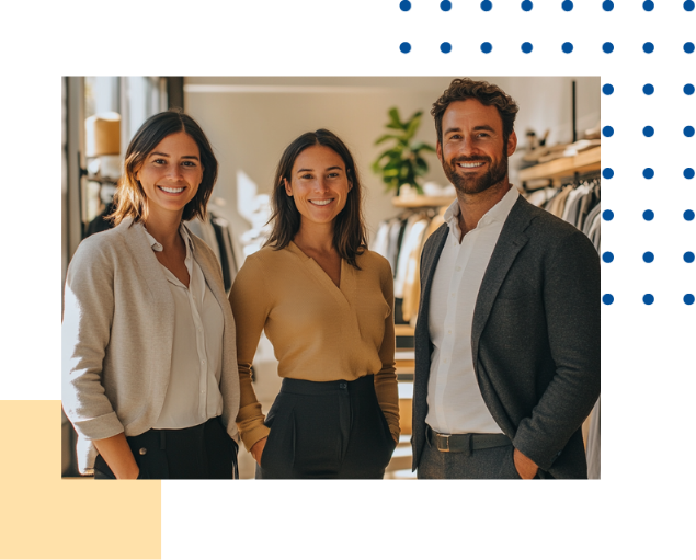 3 retail employees smiling at camera